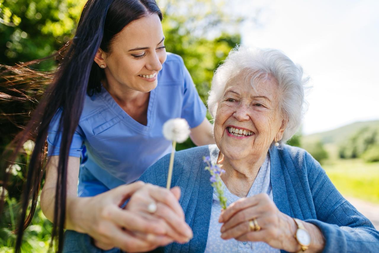 Staff giving apples to patient